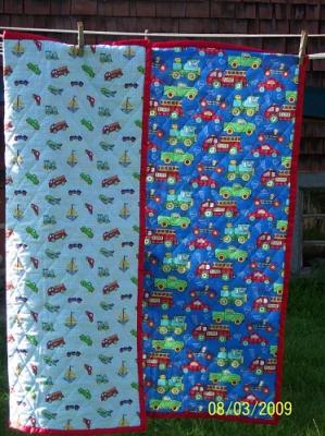 This quilt is made from prequilted fabric with a red satin binding applied by Linda Monasky.